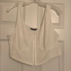 Cropped white corset-like tank top